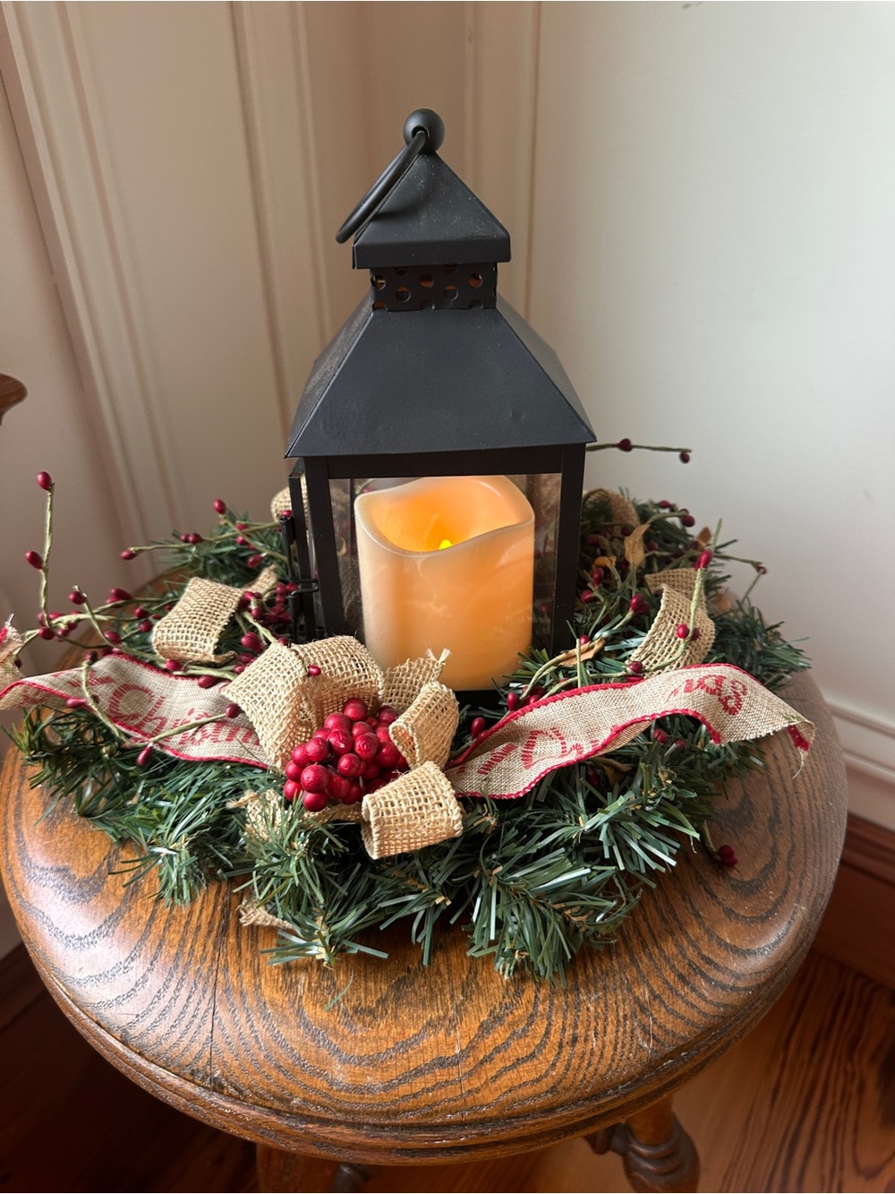 Black Metal Lantern Holiday Centerpiece with Cream Candle and Greenery